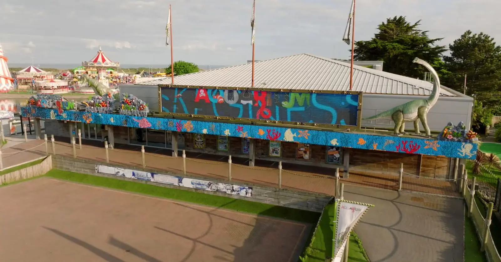 Skegness Aquarium from the seafront, with the dinosaurs visible outside